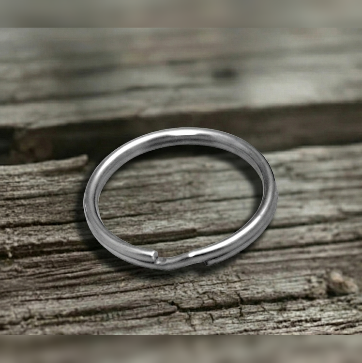 Stainless steel Split ring on a wooden surface