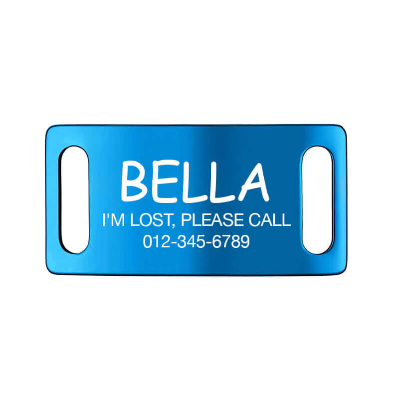 Blue slide-on dog ID tag labeled 'Bella' with 'I'm lost, please call' and emergency contact number, ensuring pet safety