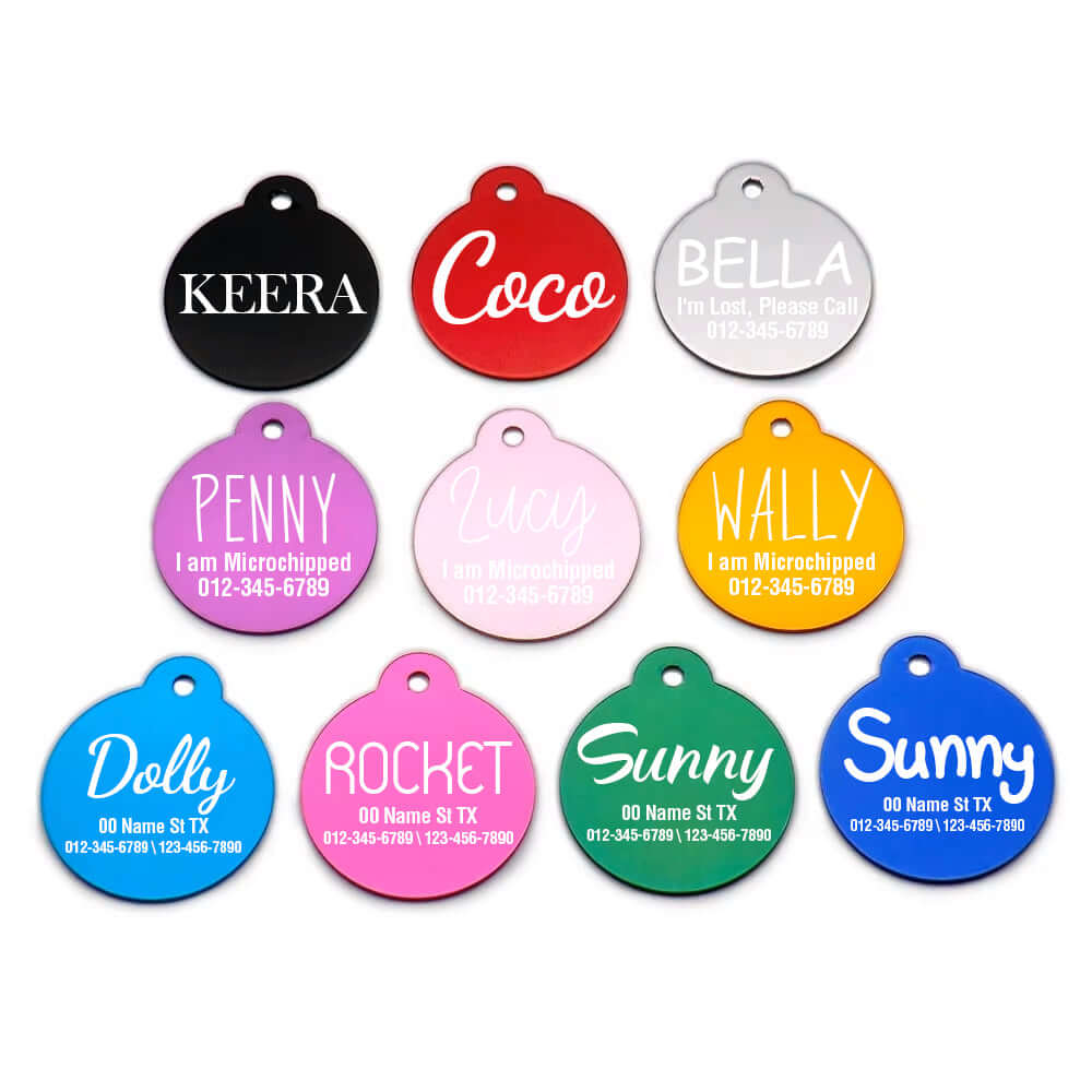 Assorted round pet ID tags in multiple colors labeled with names like Keera, Coco, Bella, and details such as 'I am Microchipped'. Perfect for pet safety and identification