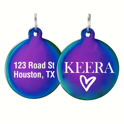 Round rainbow stainless steel dog tag engraved with the name 'Keera' and heart icon on one side, and address '123 Road St, Houston, TX' on the other for secure pet identification.